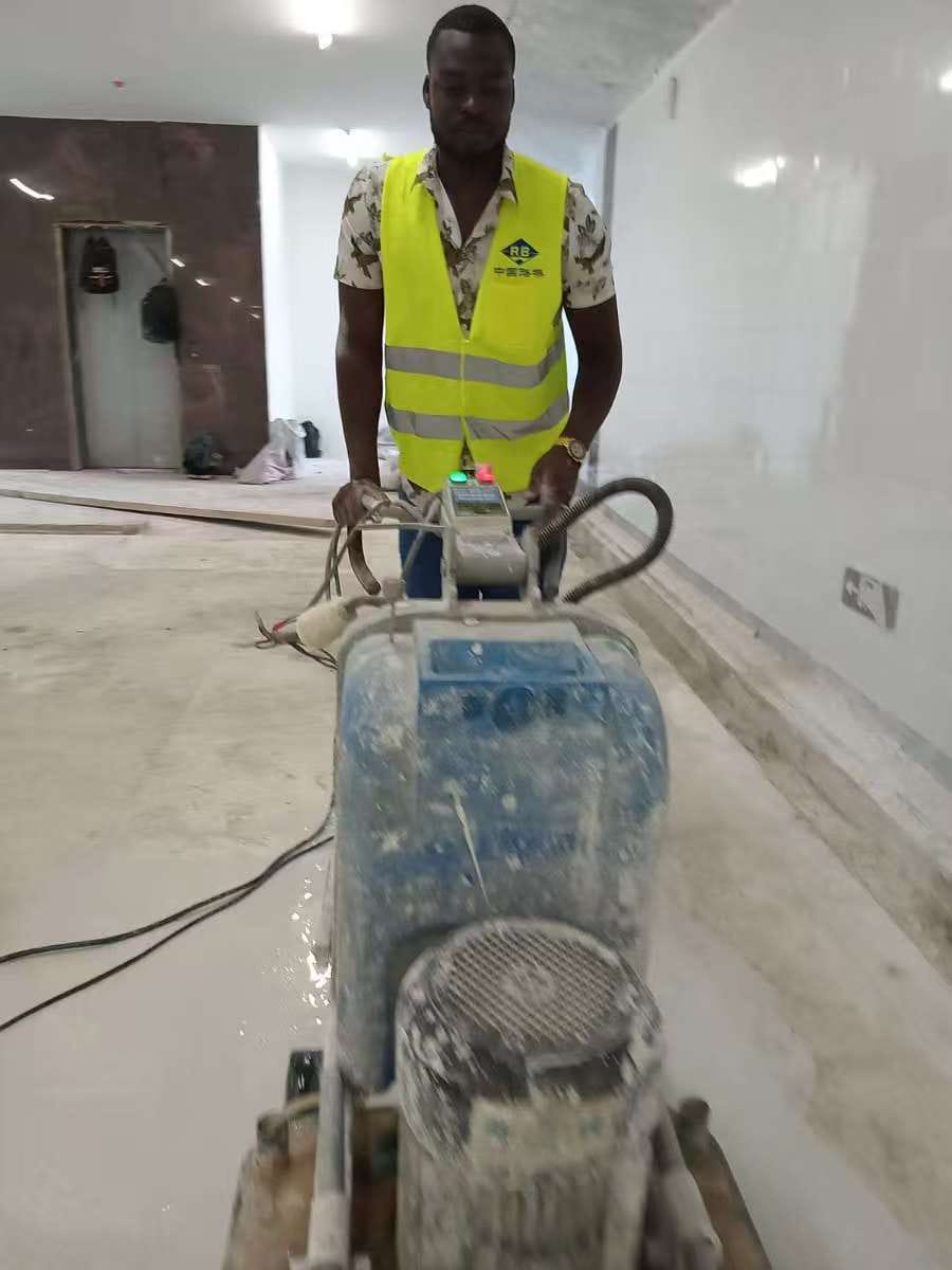 Craftsman operating planetary diamond concrete grinder